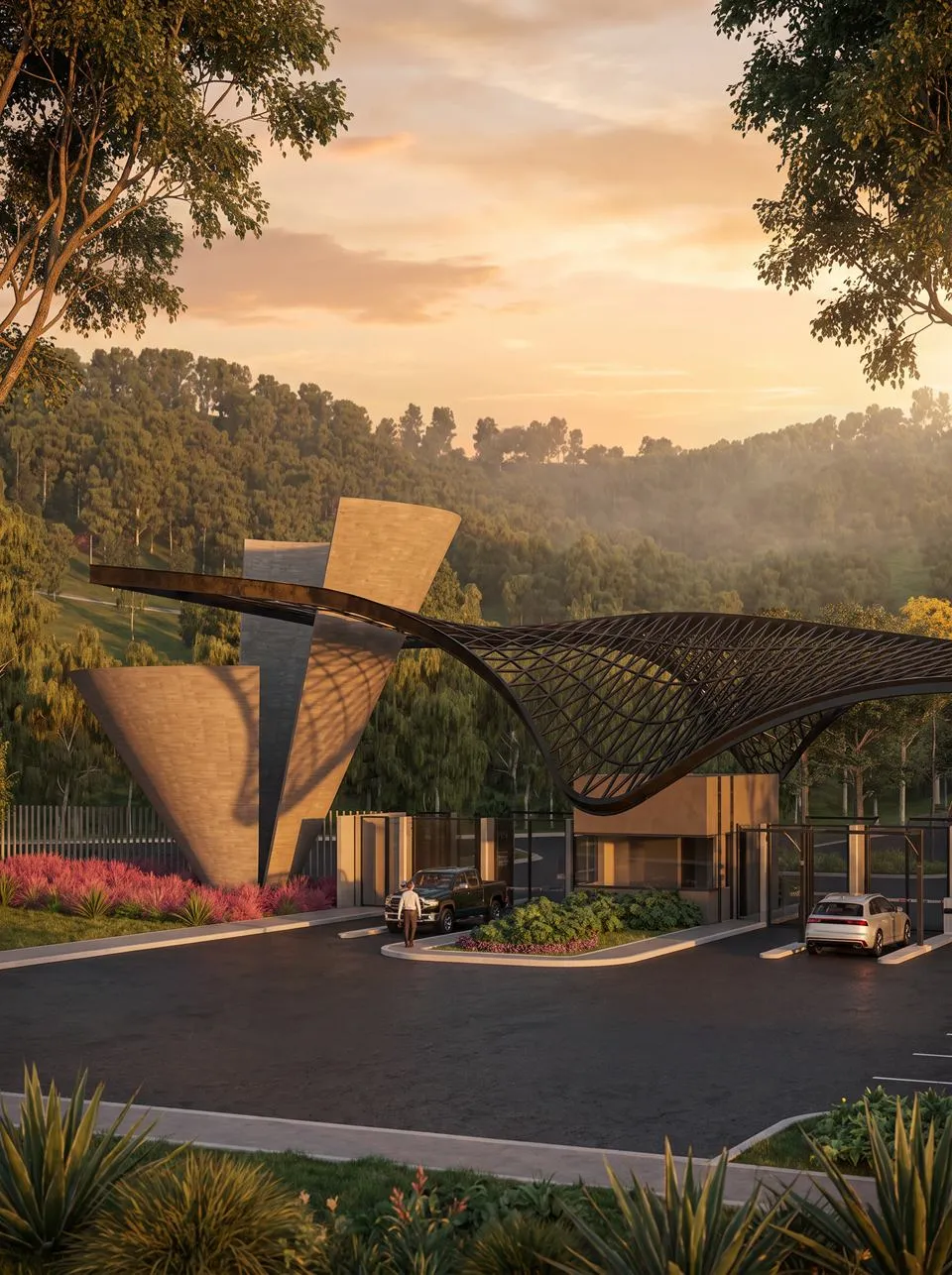 Portal de acesso do Villa Arbô ao entardecer, emoldurado pela mata