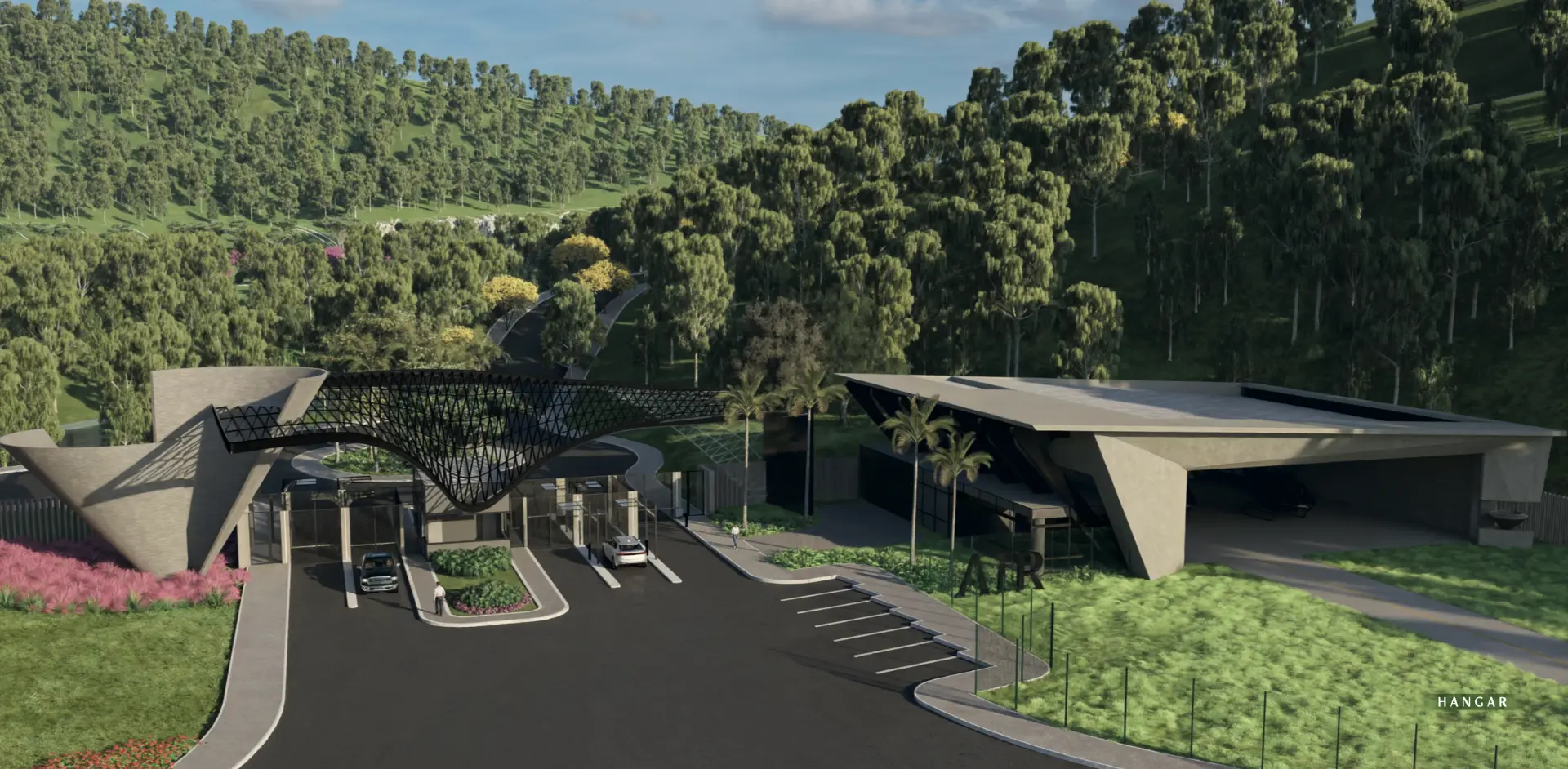 Portal de acesso e hangar, cercados pela mata